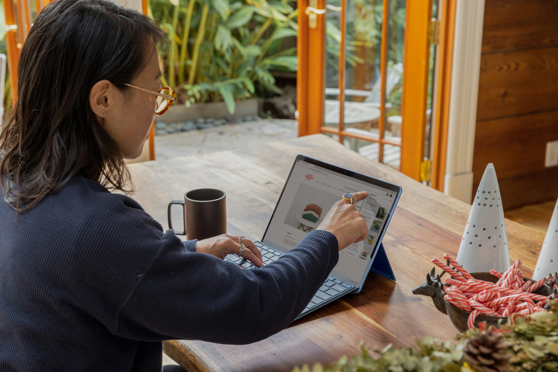 A woman working at a laptop - sole proprietorship examples