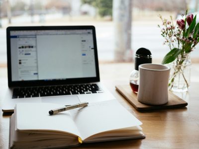 a notebook and laptop