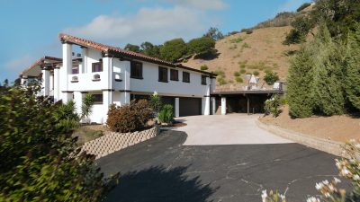 a white house with driveway